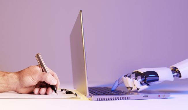 An electronic hand at a computer opposite a human hand with a pen and paper to represent manual and automated testing.