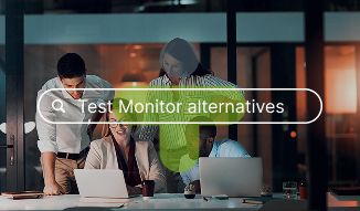 A group of people looking around a table with laptops and documents with a TestMonitor logo on top.