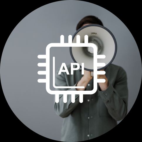 Testpad-has-an-API Image of someone at a microphone making an announcement with API logo ontop.
